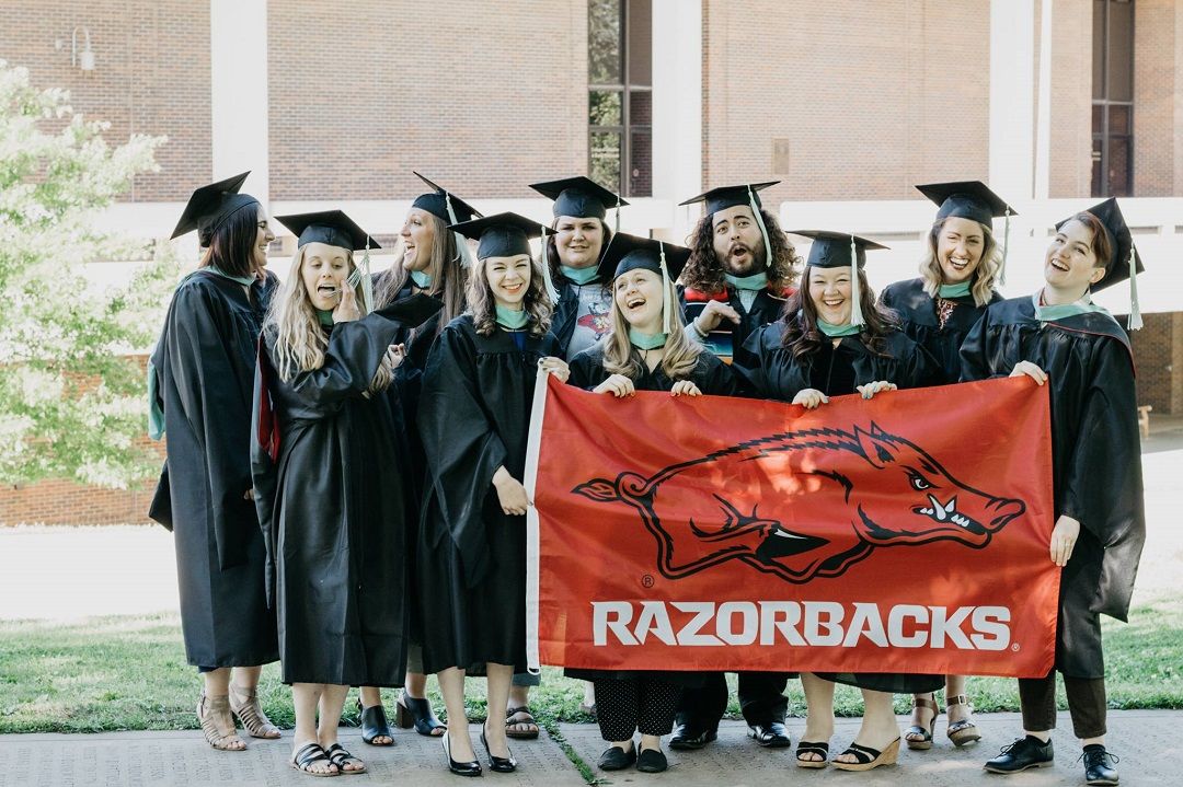 Graduate students in the Higher Education Program celebrate their graduation.